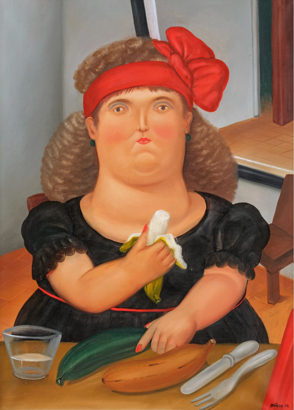 COLOMBIANA COMIENDO BANANA